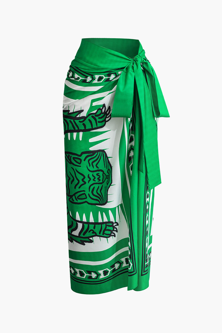 a green and white skirt with a dragon print on it