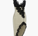 a white dress with black lace on it