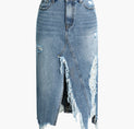 a woman wearing a denim skirt with torn edges