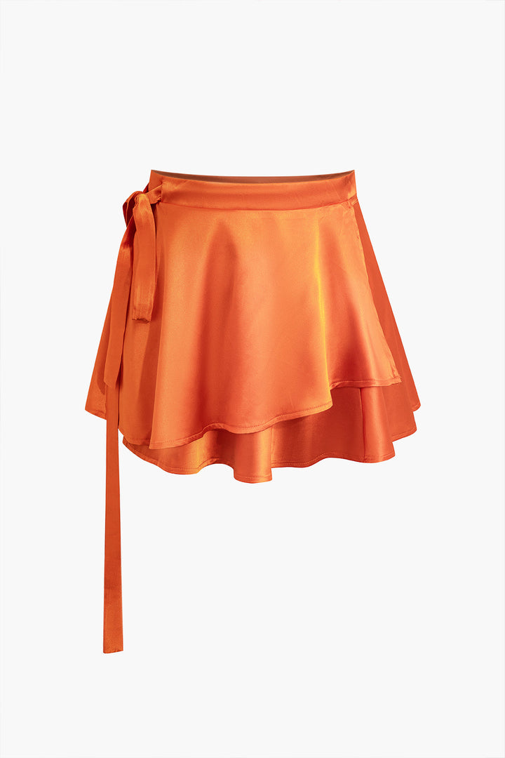 an orange skirt with a bow on the side
