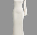 a white dress with a bow on the shoulder