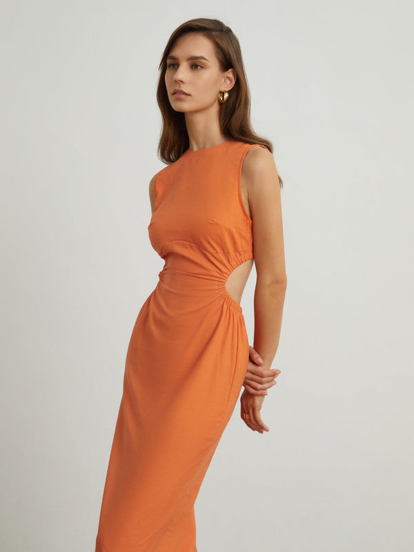 a model in an orange dress