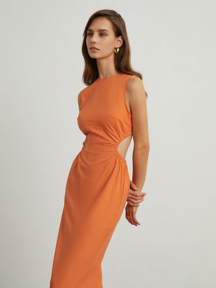 a model in an orange dress