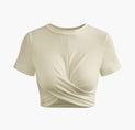 a white crop top with a twist on the front