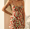 a woman wearing a floral print dress