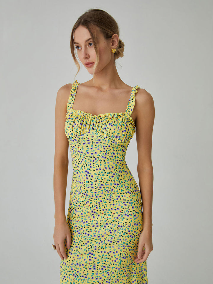 a woman in a yellow dress with polka dots on it