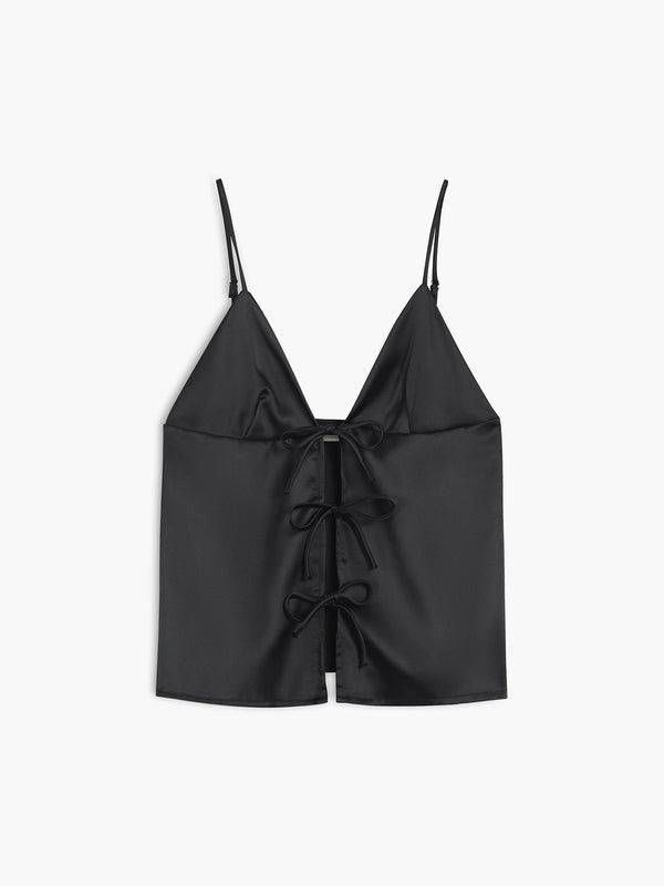 a black crop top with a bow at the front