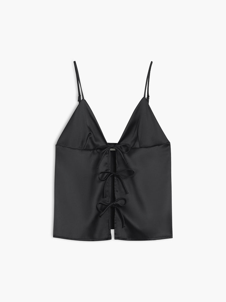 a black crop top with a bow at the front
