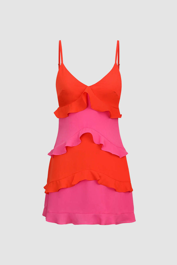 a bright pink and red dress with a large bow at the back