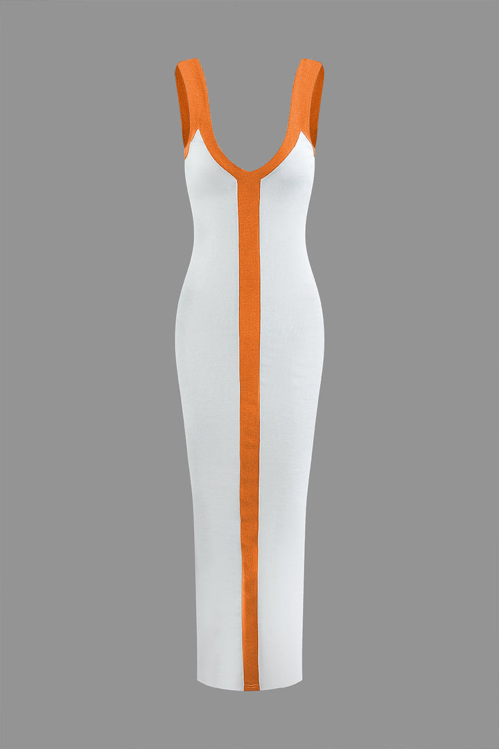 a white and orange dress on a grey background