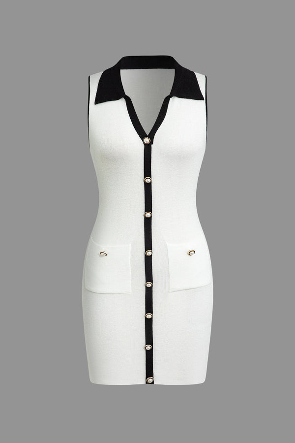 a white dress with black trims and buttons
