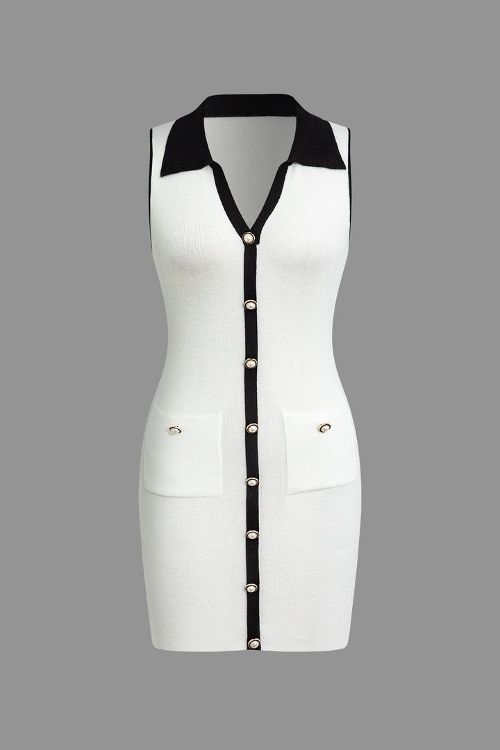 a white dress with black trims and buttons