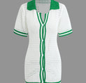 a white shirt with green trim and a green collar