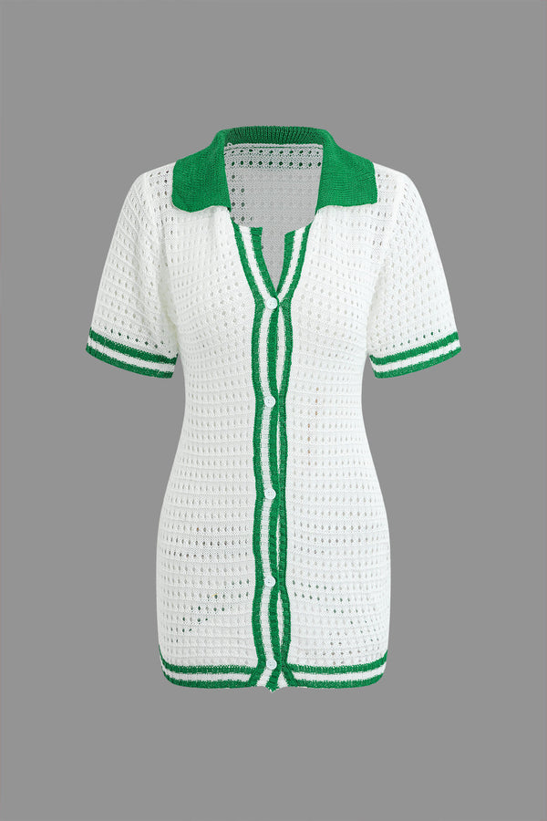 a white shirt with green trim and a green collar