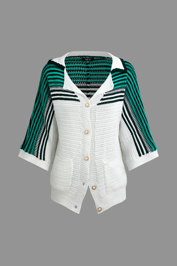 a white cardigan sweater with green and black stripes
