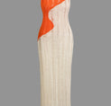 a white and orange dress on a gray background