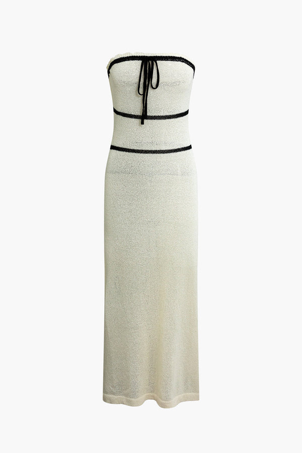 a white dress with a black belt