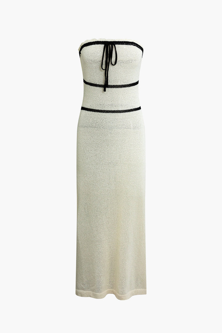 a white dress with a black belt