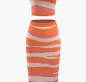 a women ' s orange and white striped dress