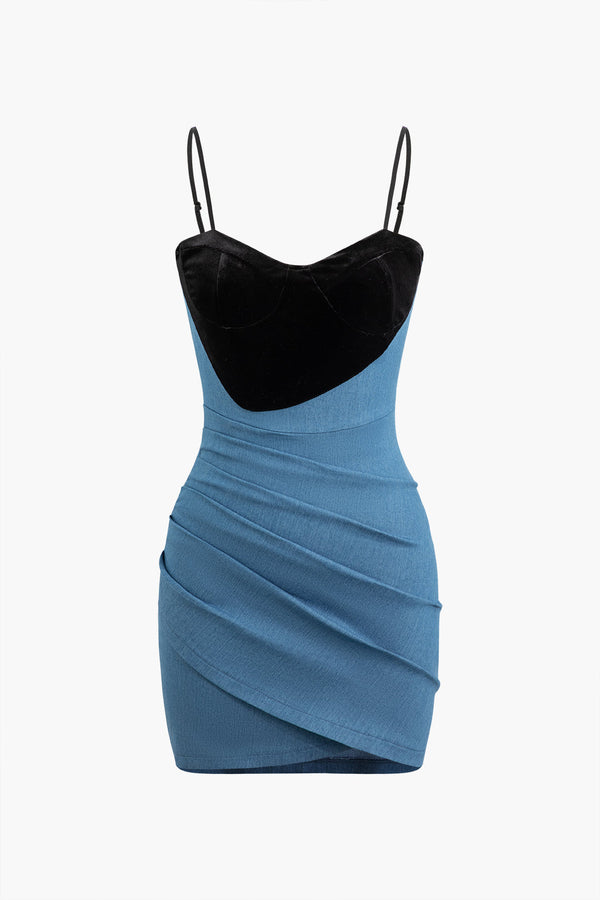 a blue and black dress on a white background