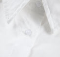 a close up of a white shirt with buttons