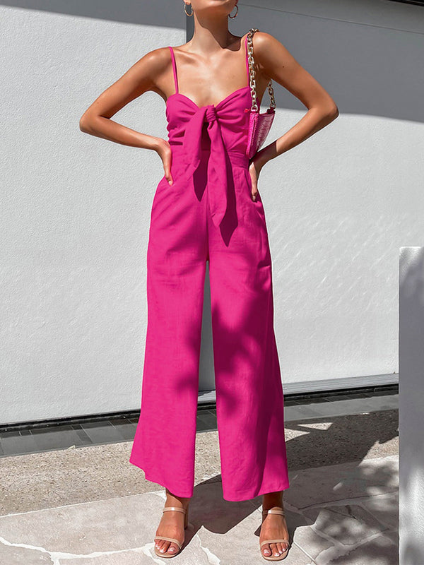 a woman wearing a pink jumpsuit