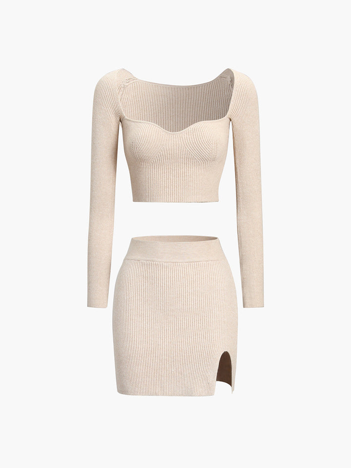 a woman in a beige sweater and skirt