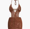 a brown bikini top with an open back and lace detailing