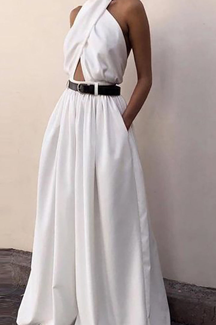 a woman wearing a white dress with a black belt