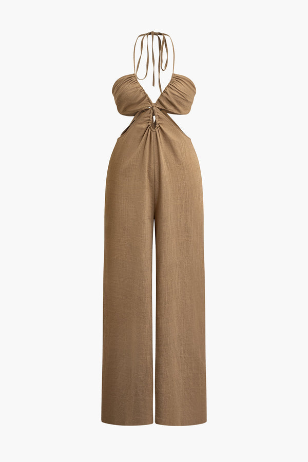 a woman is wearing a tan jumpsuit