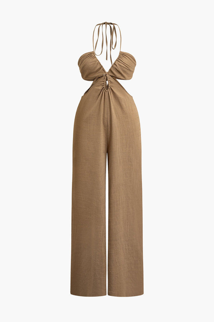 a woman is wearing a tan jumpsuit