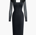 a black dress with long sleeves and a cutout