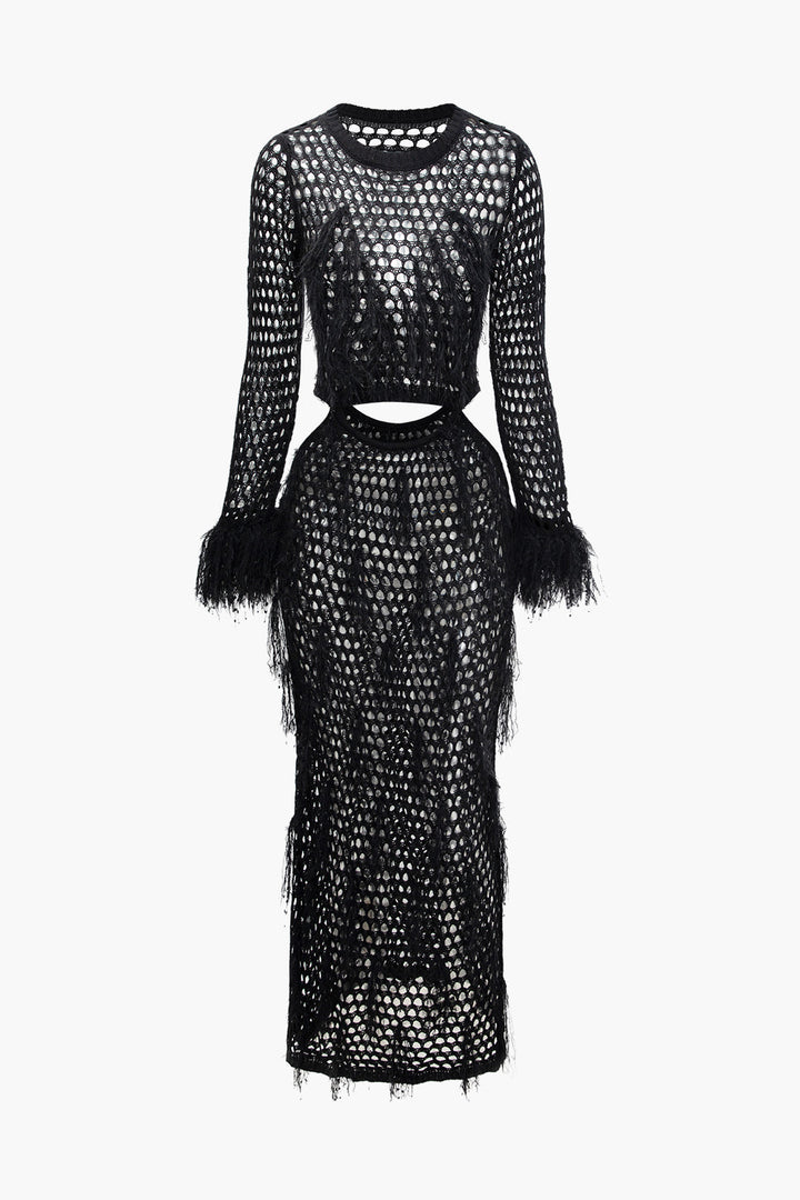 a black lace dress with long sleeves and fringes