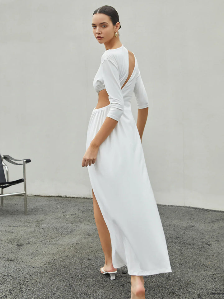 a woman wearing a white dress and sandals