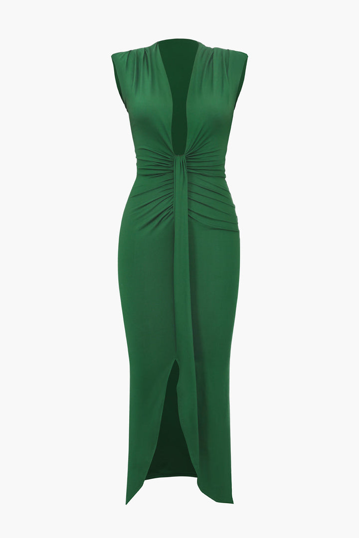a green dress with a twist on the front