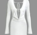 a white dress with long sleeves and a plunging neckline
