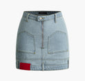 a denim skirt with zippers and pockets