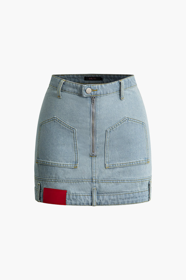 a denim skirt with zippers and pockets
