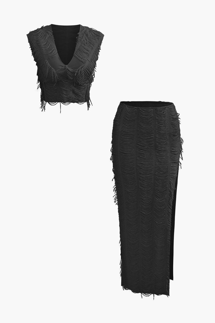 a black top and skirt with fringes on it