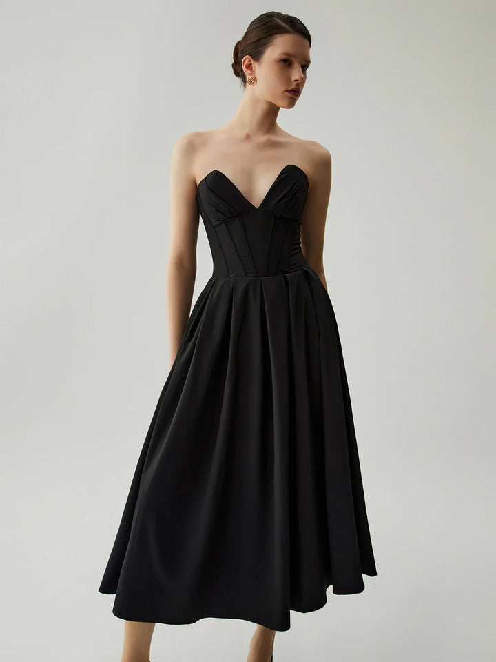 a woman in a black dress