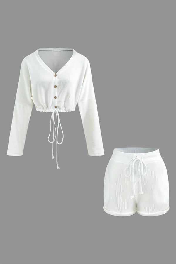 a white cropped top and shorts set