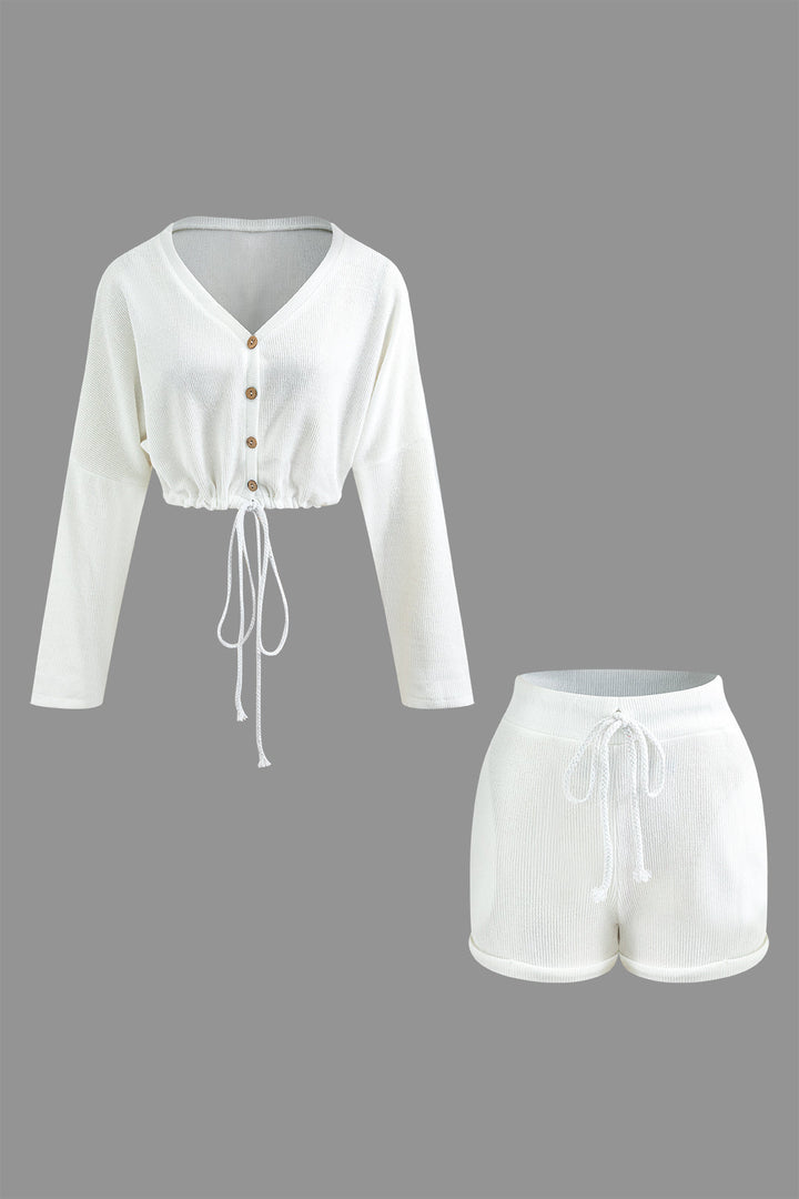 a white cropped top and shorts set