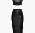 a black leather skirt and crop top