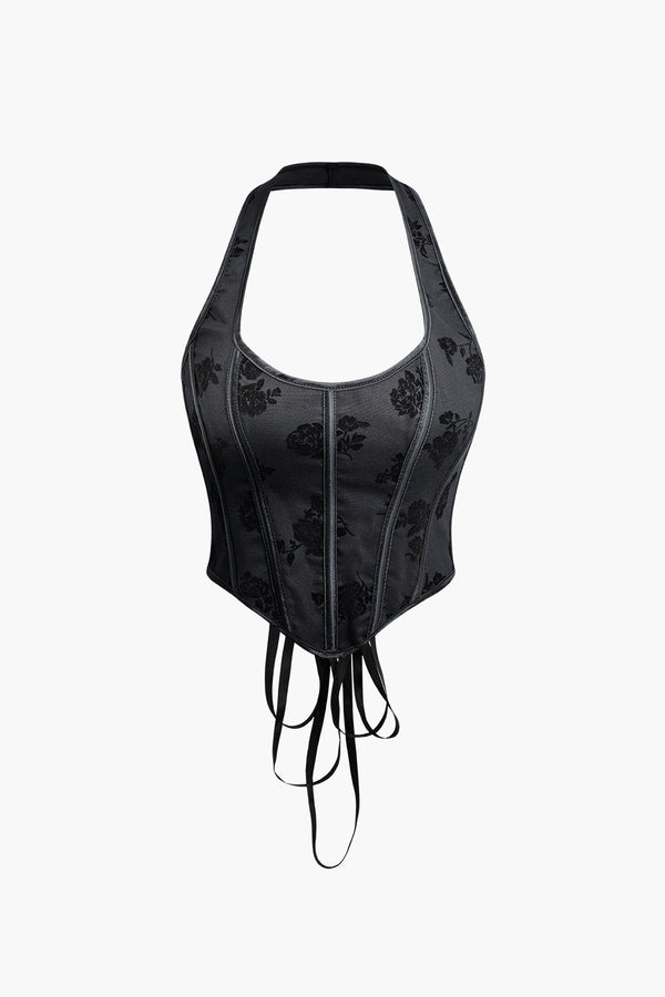 a black corset with a black floral design on it