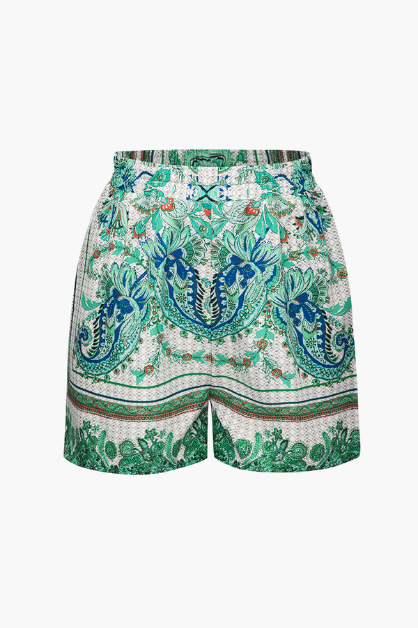 a white shorts with green and blue floral print