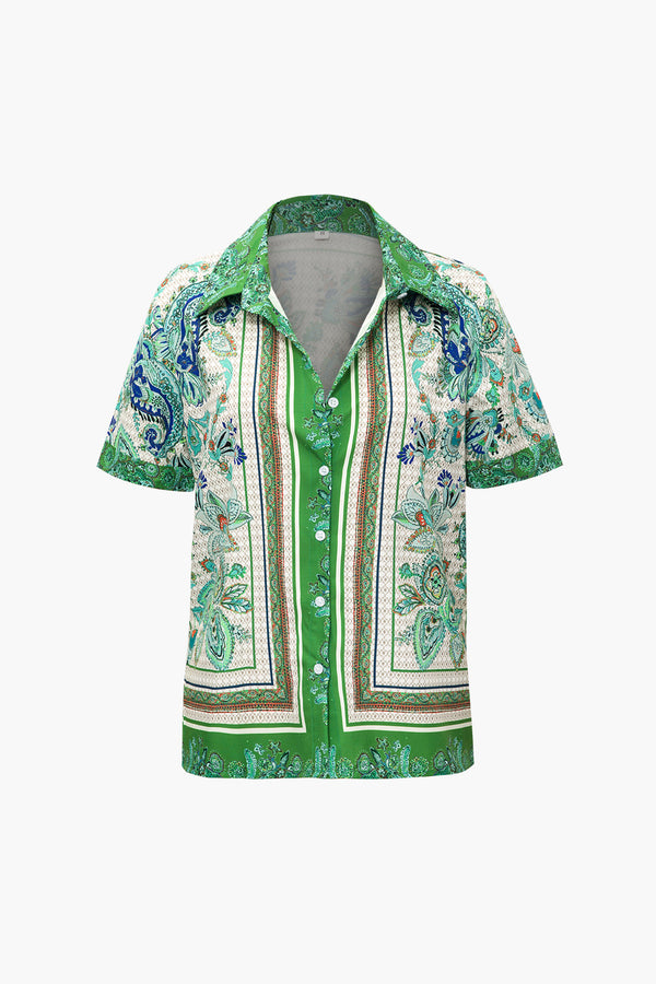 a green and white shirt with paisley print