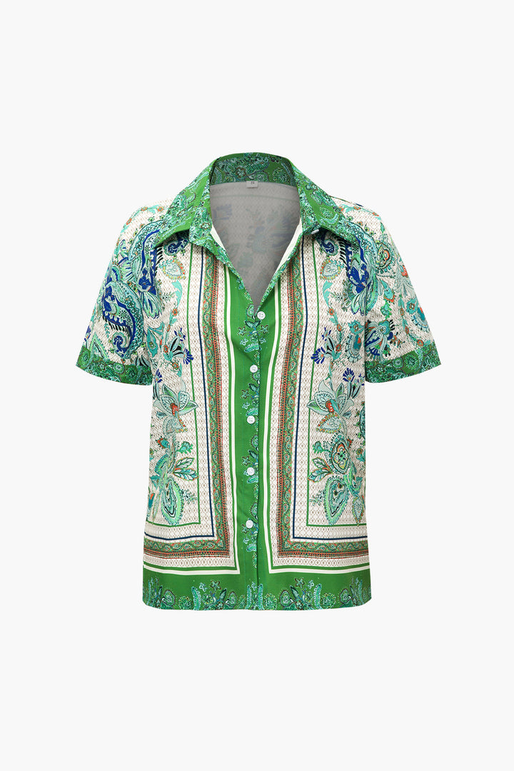 a green and white shirt with paisley print