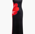 a black dress with a red flower on it