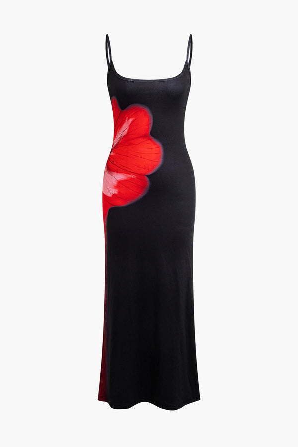 a black dress with a red flower on it