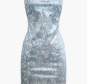 a blue dress with white flowers on it